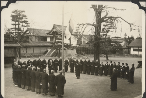 Buddhist priests raising a flag (ddr-densho-432-155)