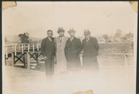 Four men on a boardwalk (ddr-densho-433-795)