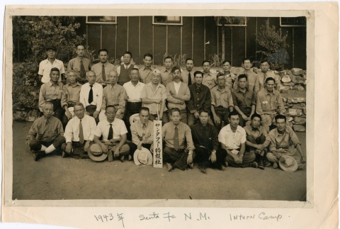 Group photograph in front of barracks (ddr-densho-298-8)