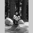 Tara Sasagawa sitting on a rock (ddr-densho-336-705)