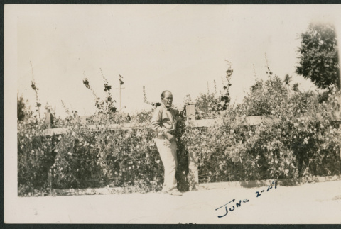 man by fence (ddr-densho-378-268)