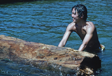 Roger Morimoto log rolling in the lake (ddr-densho-336-1130)