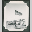 U.S. Flag with cars in background (ddr-densho-475-723)