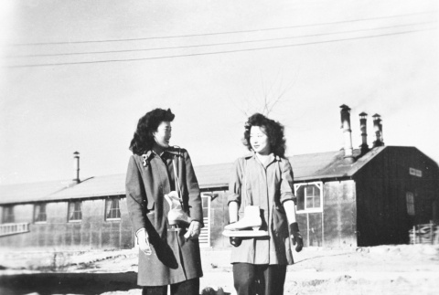 Japanese Americans carrying ice skates (ddr-densho-39-40)