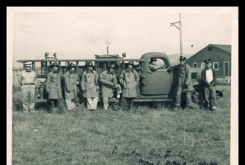 Firemen in front of fire truck at Tule Lake (ddr-csujad-55-2202)