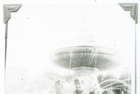 William Kochiyama and one other in front of fountain (ddr-densho-1007-822)