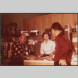 Chester Sakura Sr. with woman and man at electronics store (ddr-densho-523-449)