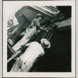 Two men working on support post, one hammering (ddr-densho-426-2262)