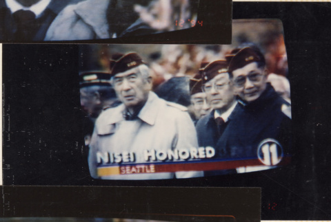 Photo of TV screen of Veterans Day event (ddr-densho-466-541)