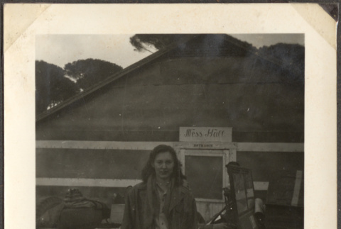 Woman standing by army jeep in front of Mess Hall (ddr-densho-466-5)