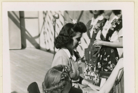 Pianist performs at a convention (ddr-densho-37-1126)