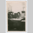 Soldier working at table (ddr-densho-368-248)