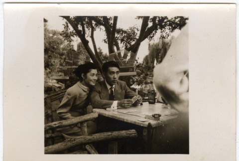 Man and woman at card table (ddr-densho-433-1105)