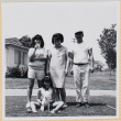 Family posing on lawn with dog (ddr-densho-522-114)