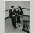 Mary Mon Toy and unidentified man walking up staircase (ddr-densho-488-6)