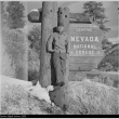 Nisei man in front of Nevada National Forest sign (ddr-densho-153-244)