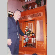 Hisamiysu Ojisan standing by altar (ddr-densho-426-2232)
