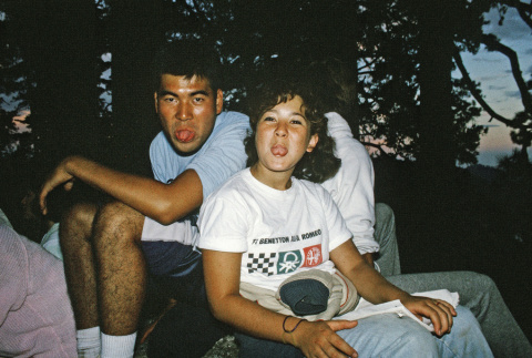 Brian Ebisui and Keri Nelson resting on a sunset hike (ddr-densho-336-1829)