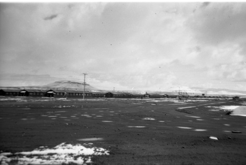Ward 4 & 7 in the snow, Castle Rock in the background (ddr-densho-570-39)