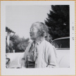 Woman standing by car (ddr-densho-522-423)