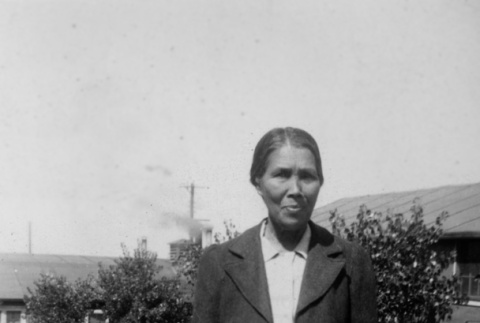 Woman standing outside barracks (ddr-ajah-6-445)