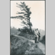 Three people standing on trail (ddr-densho-523-395)